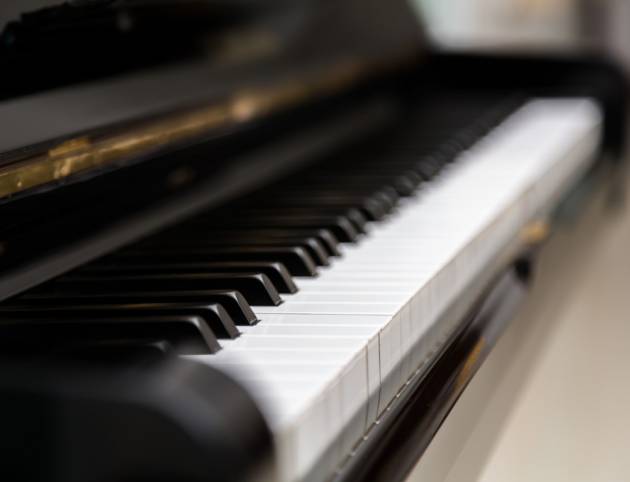 blurred-view-piano-keys-scaled-e1626164114579